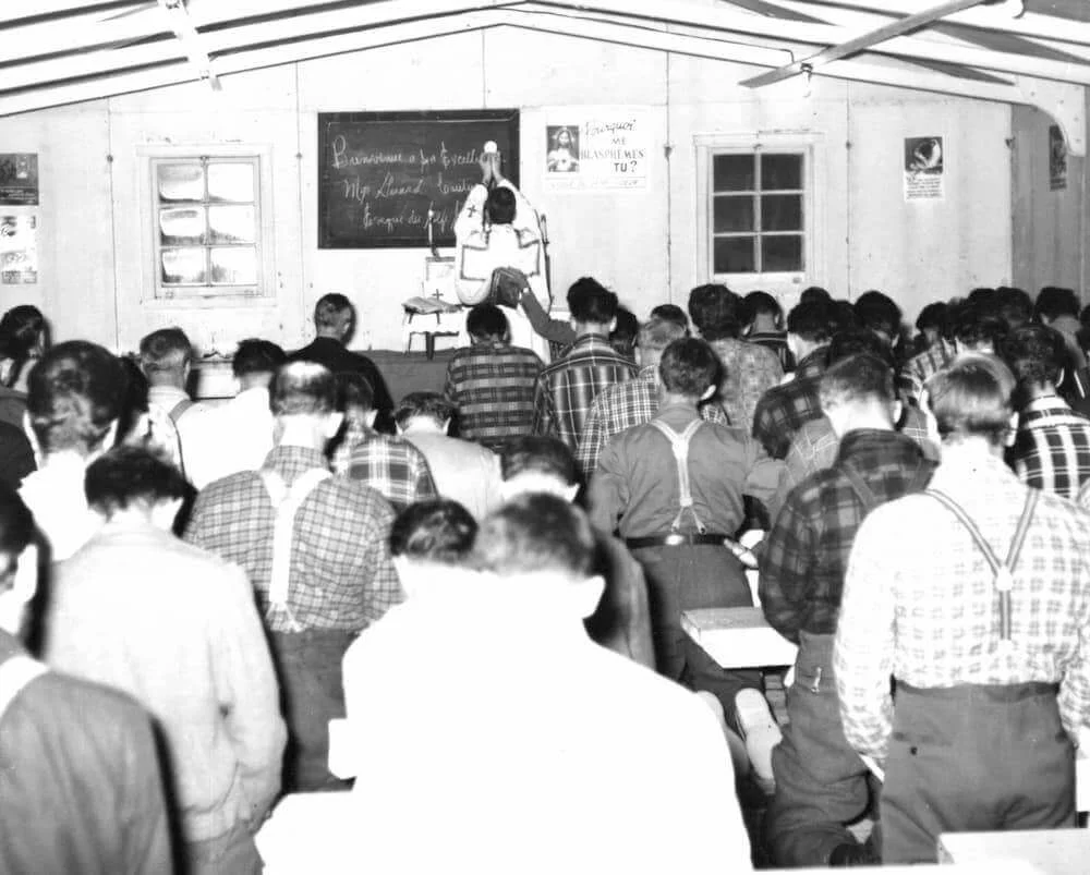 Workers gather for a celebration in the camp chapel