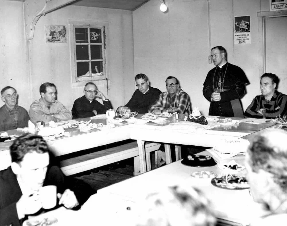 Bishop Couturier takes part in a meeting around the table