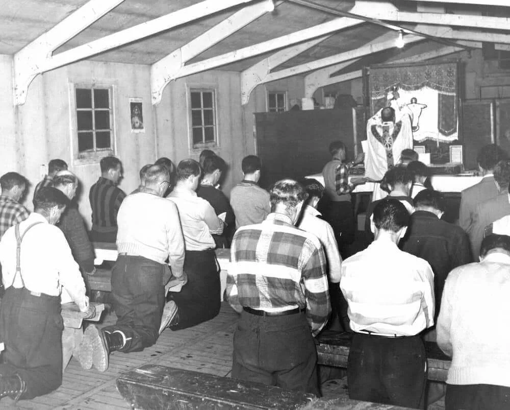 Workers pray in the construction-site chapel